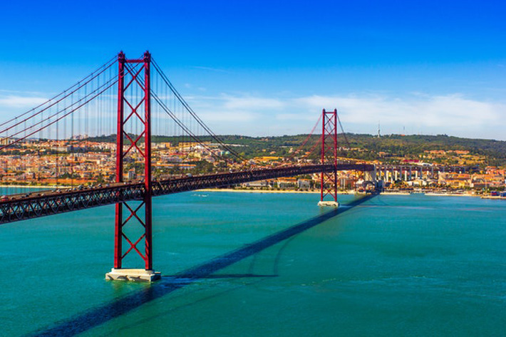 Discover Lisbon from Land and a River Cruise bridge
