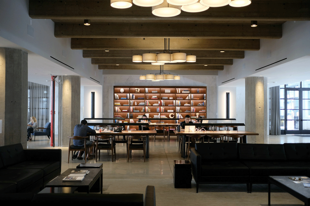 An open commercial workspace with shelving and stored equipment