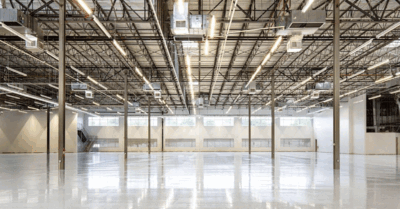 A spacious modern warehouse interior with high ceilings