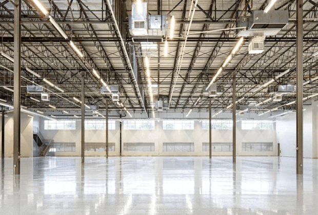 A spacious modern warehouse interior with high ceilings