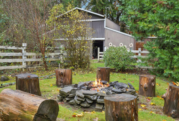A small garden bonfire burning safely in a UK garden during autumn