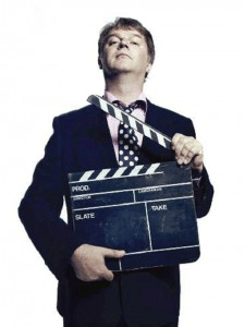 paul merton comedian with clapperboard