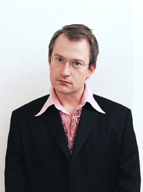 comedian robin ince pink shirt black jacket