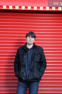 simon armitage interview yorkshire poet standing red shutters