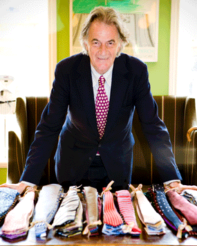 fashion icon paul smith in leeds store with ties blue suit red spotted tie