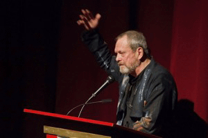 terry gilliam in bradford raising hand on podium