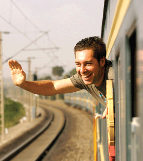 man waving from train in siberia